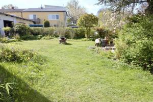 a grassy yard with a house in the background at Ferienwohnung No 15 in Pfullendorf