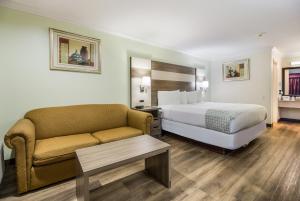 Ένα ή περισσότερα κρεβάτια σε δωμάτιο στο Americas Best Value Inn Columbus +24 φωτογραφίες