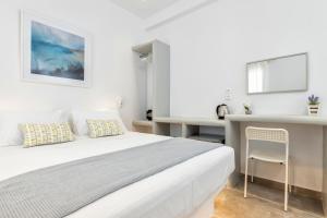 Postel nebo postele na pokoji v ubytování Pelican Paros