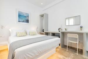 Postel nebo postele na pokoji v ubytování Pelican Paros