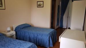 Postel nebo postele na pokoji v ubytování Albergo ristorante Da Tunon