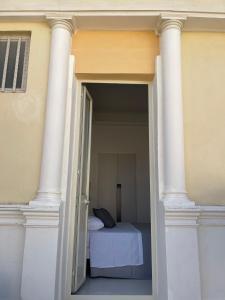 Postel nebo postele na pokoji v ubytování Casa Crispi
