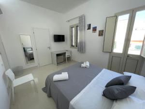 Postel nebo postele na pokoji v ubytování Casa Crispi