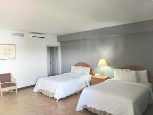 Postel nebo postele na pokoji v ubytování Hotel Posada Tierra Blanca + 17 fotografií