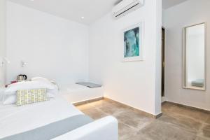 Postel nebo postele na pokoji v ubytování Pelican Paros