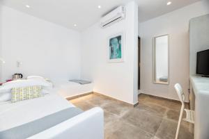 Postel nebo postele na pokoji v ubytování Pelican Paros
