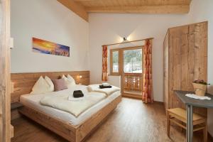 Posteľ alebo postele v izbe v ubytovaní Ferienhaus Rohrmoos Maria Alm