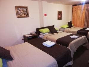 Postel nebo postele na pokoji v ubytování Hotel Bonaventure
