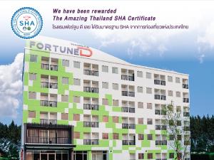 Ett certifikat, pris eller annat dokument som visas upp på Fortune D Hotel Loei