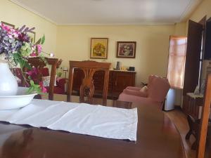 a living room with a table with a white sheet on it at La Casa del Valle in Soncillo