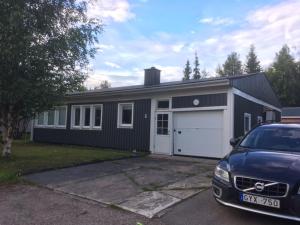 a house with a car parked in front of it at House in the heart of Lapland P4 in Puoltikasvaara