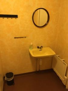 a bathroom with a sink and a mirror on the wall at House in the heart of Lapland P4 in Puoltikasvaara +8 photos