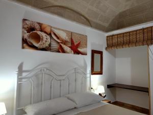 Un pat sau paturi într-o cameră la Case Vacanze Mariposa