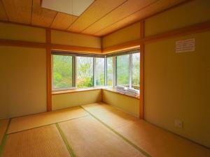 an empty room with two windows in a room at Rigeru - Vacation STAY 11338 in Nasu