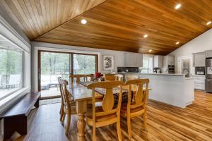 a kitchen and dining room with a table and chairs at Newberry Lane 10 | Discover Sunriver in Sunriver