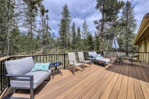 a deck with chairs and a couch and a table at Newberry Lane 10 | Discover Sunriver in Sunriver
