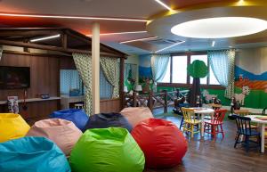 a room with colorful bean bags on the floor at Bella Gramado in Gramado