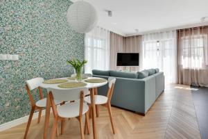 Televízia a/alebo spoločenská miestnosť v ubytovaní Ocean Mint - Apartamenty przy plaży