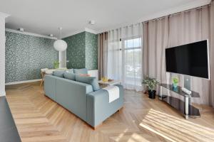 Televízia a/alebo spoločenská miestnosť v ubytovaní Ocean Mint - Apartamenty przy plaży