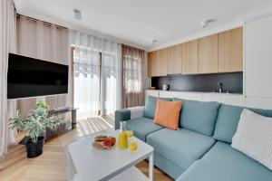 Televízia a/alebo spoločenská miestnosť v ubytovaní Ocean Mint - Apartamenty przy plaży