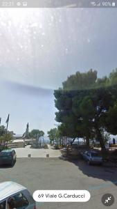 a view of a parking lot with cars parked at Casetta in centro in Soveria Simeri