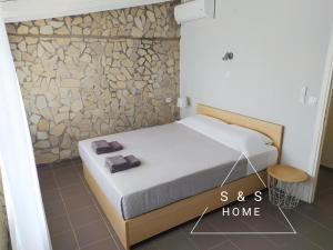 Postel nebo postele na pokoji v ubytování S&S Home