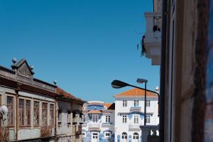 a view from a window of a city street at Soldouro Train Suites in Aveiro