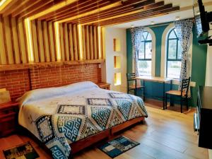 A bed or beds in a room at Hotel Bello Amanecer