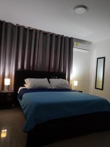 מיטה או מיטות בחדר ב-Hotel Prado 53