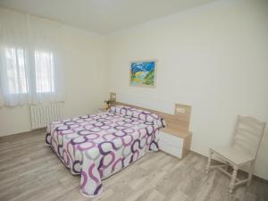 Ένα ή περισσότερα κρεβάτια σε δωμάτιο στο Apartamentos VUT Gandarela