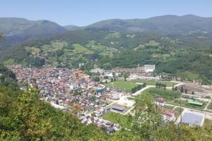 an aerial view of a town in the mountains at WOLF'S PLANE Luxury Isolated Mountain House for Digital Nomads in Fojnica