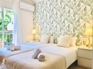 Posteľ alebo postele v izbe v ubytovaní Andalucía II & balcony by ELE Apartments