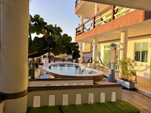 a house with a swimming pool on a patio at Casa Mia in Puerto Escondido