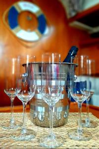 a group of wine glasses sitting on a table at Velero Babu in Puerto Calero