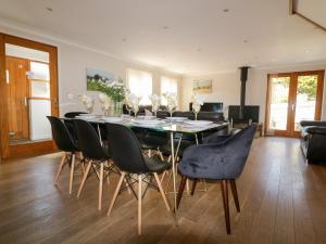 a dining room with a table and chairs at Carpe Diem in Crantock