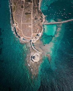 an aerial view of an island in the ocean at Eleni Suites Methoni in Methoni