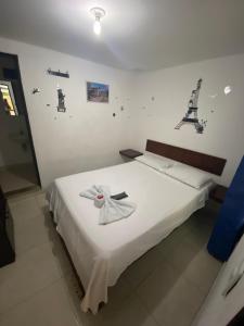 Postel nebo postele na pokoji v ubytování Hotel Policarpa