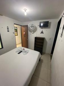Postel nebo postele na pokoji v ubytování Hotel Policarpa