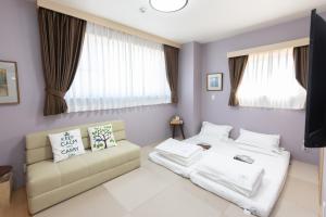 Postel nebo postele na pokoji v ubytování 灯光旅館 Light hotel