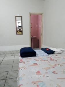 Posteľ alebo postele v izbe v ubytovaní Kitnet BH