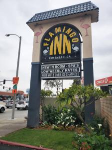 a sign for the entrance to a nume inn at Flamingo Inn in Rosemead