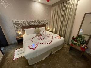 Säng eller sängar i ett rum på فندق الميار , Al Mayar Hotel