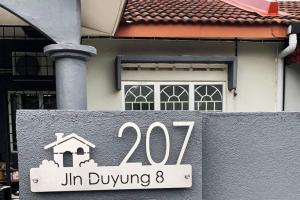 a house with a sign that reads jin buying at STAY N REST SWEET HOME Duyung 207 in Seremban