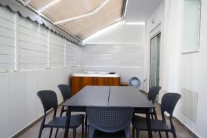 a conference room with a table and chairs at Rodini House in Rhodes Town