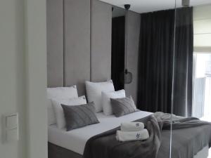 Posteľ alebo postele v izbe v ubytovaní EL Apartments - Aries