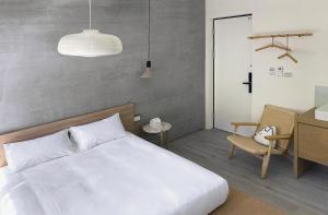 Postel nebo postele na pokoji v ubytování Little Inn by LAGOM