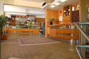 a room with a bar in a restaurant with a counter at Hotel Ismaele in Chiusi