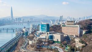 a large city with a large bridge over it at Grand Walkerhill Seoul in Seoul