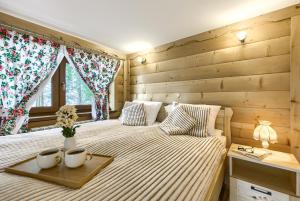 Posteľ alebo postele v izbe v ubytovaní Apartamenty VILLA SKI-BÓWKI