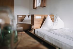 Voodi või voodid majutusasutuse Hotel Aichingerwirt toas